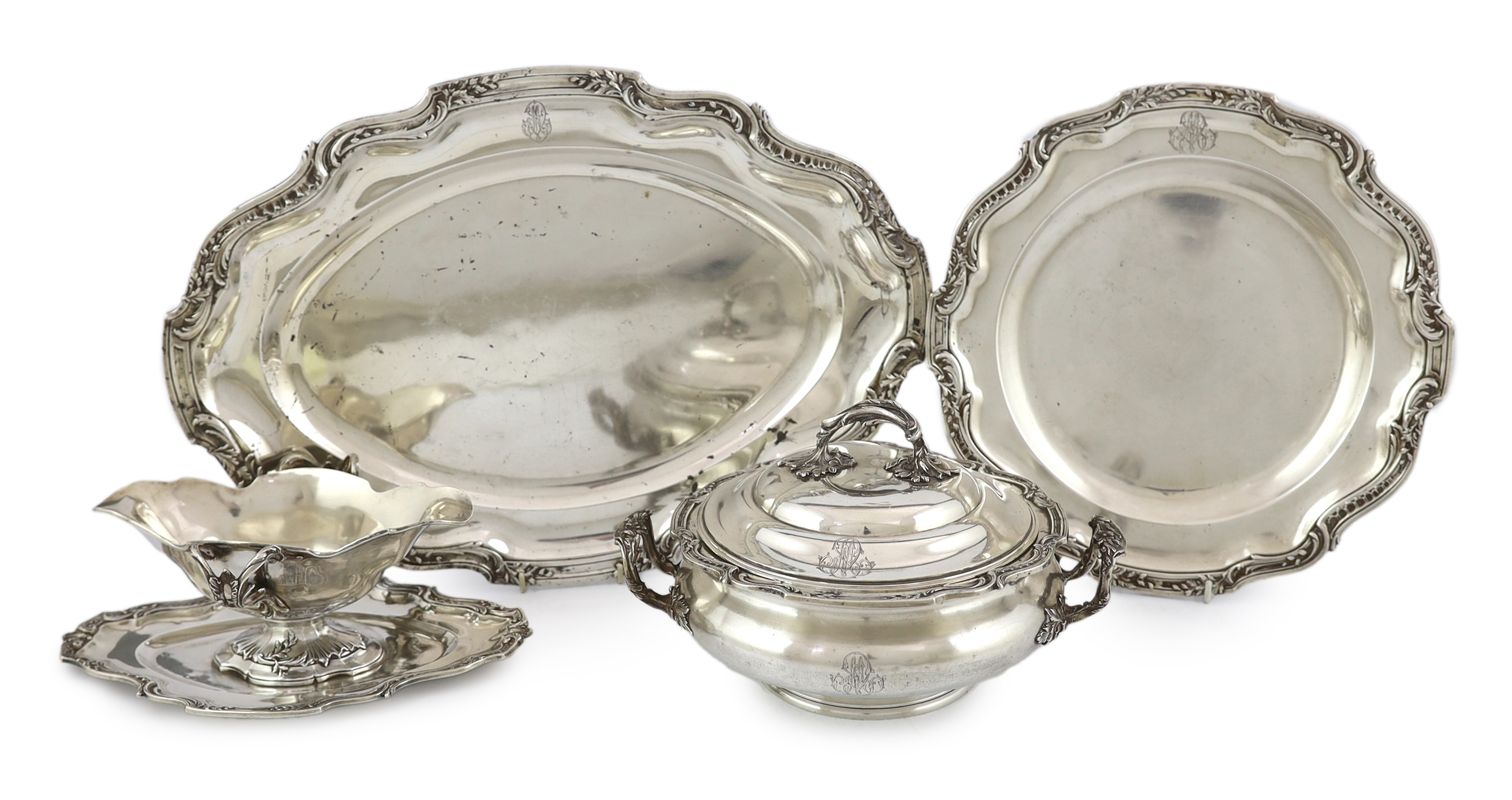 A late 19th century French 950 standard silver tureen and cover, a sauceboat on fixed stand and two serving dishes, by V. Boivin, Paris